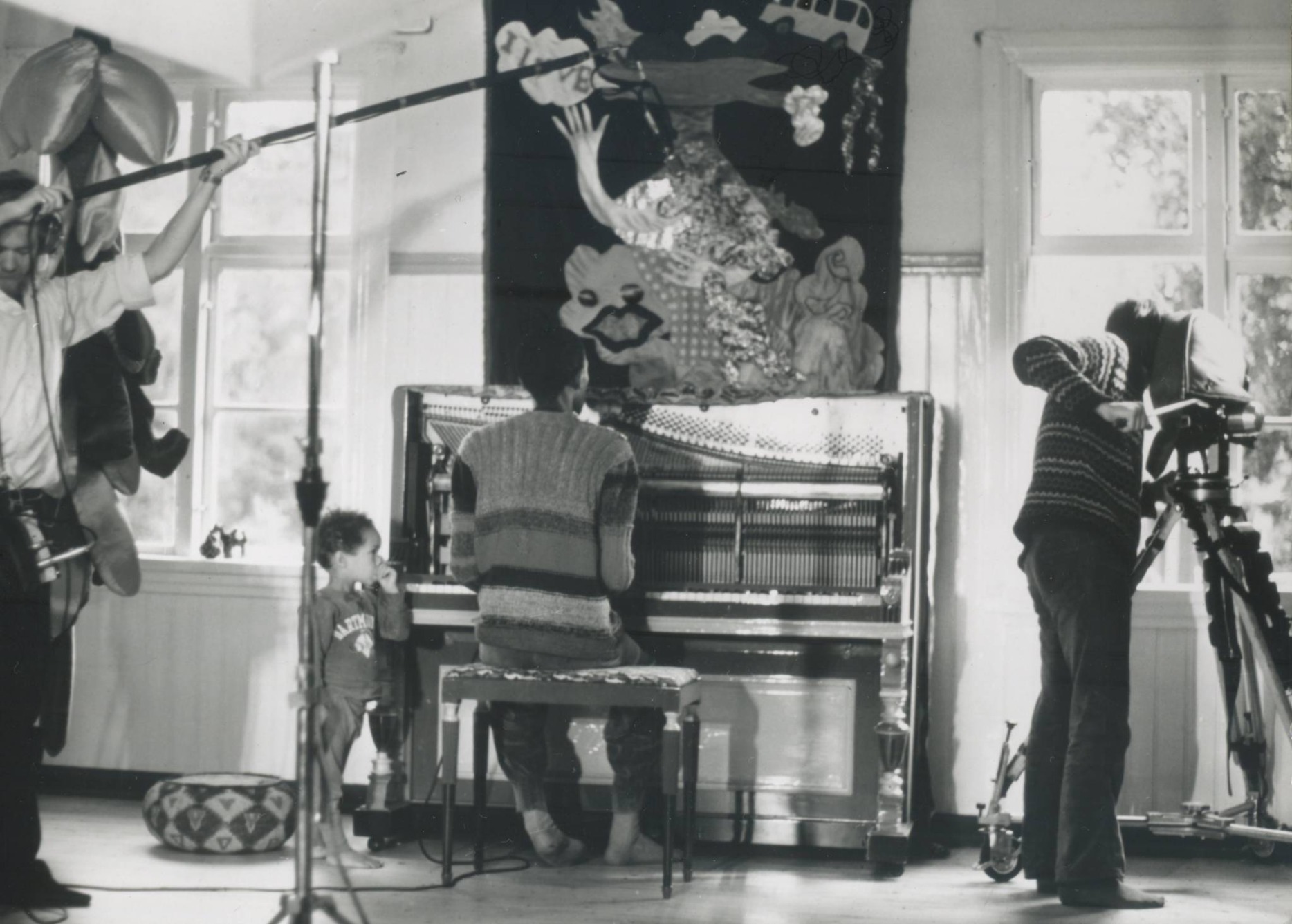 Archive photo of musician Don Cherry and his son Eagle-Eye Cherry by a piano.