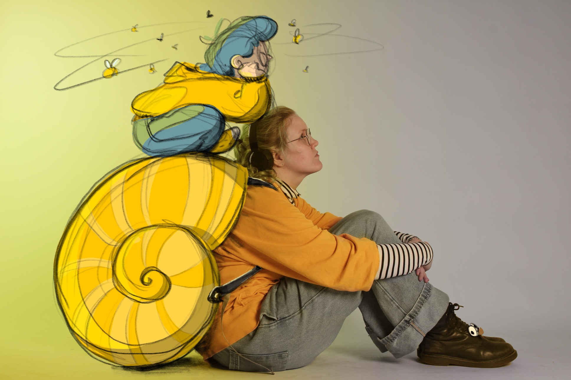 A person with an illustrated snail's shell on their back