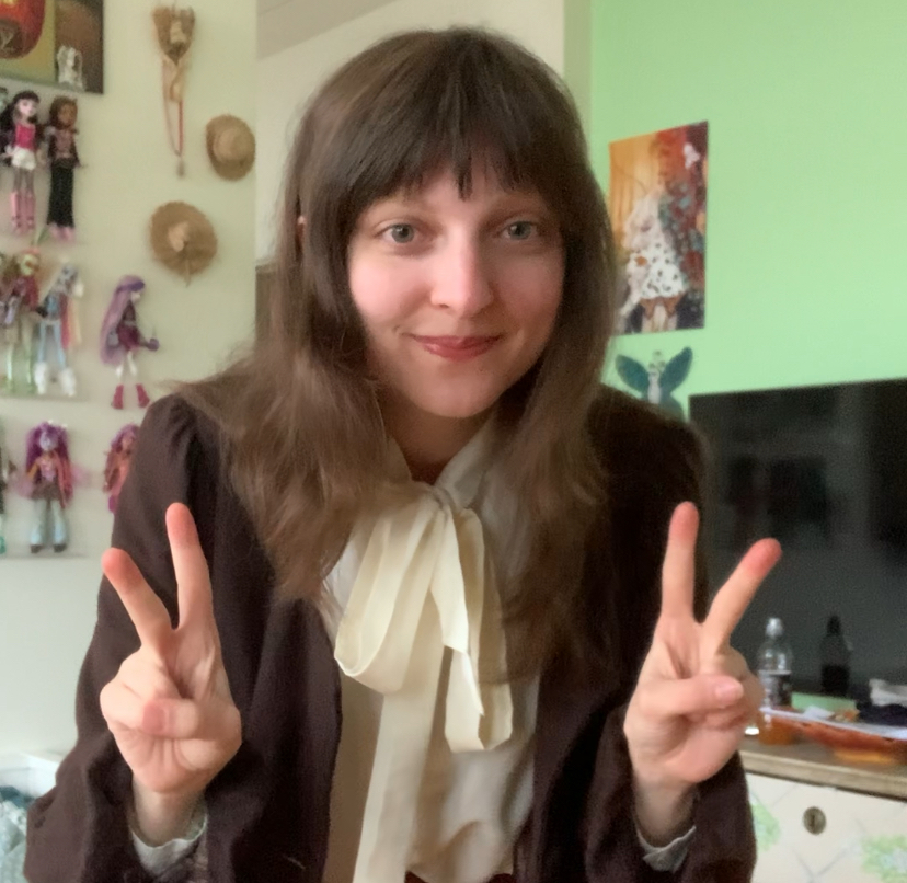 A photo of a person making peace signs with their hands